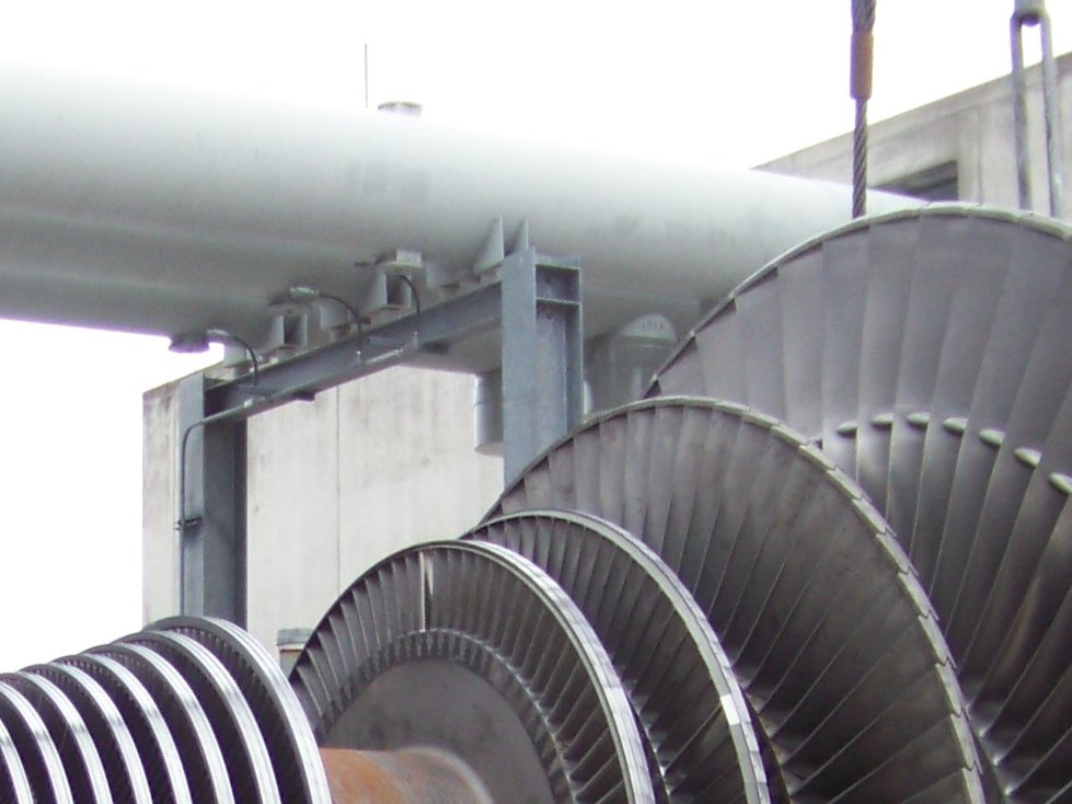 Rotor blade stages under overhead pipe rack